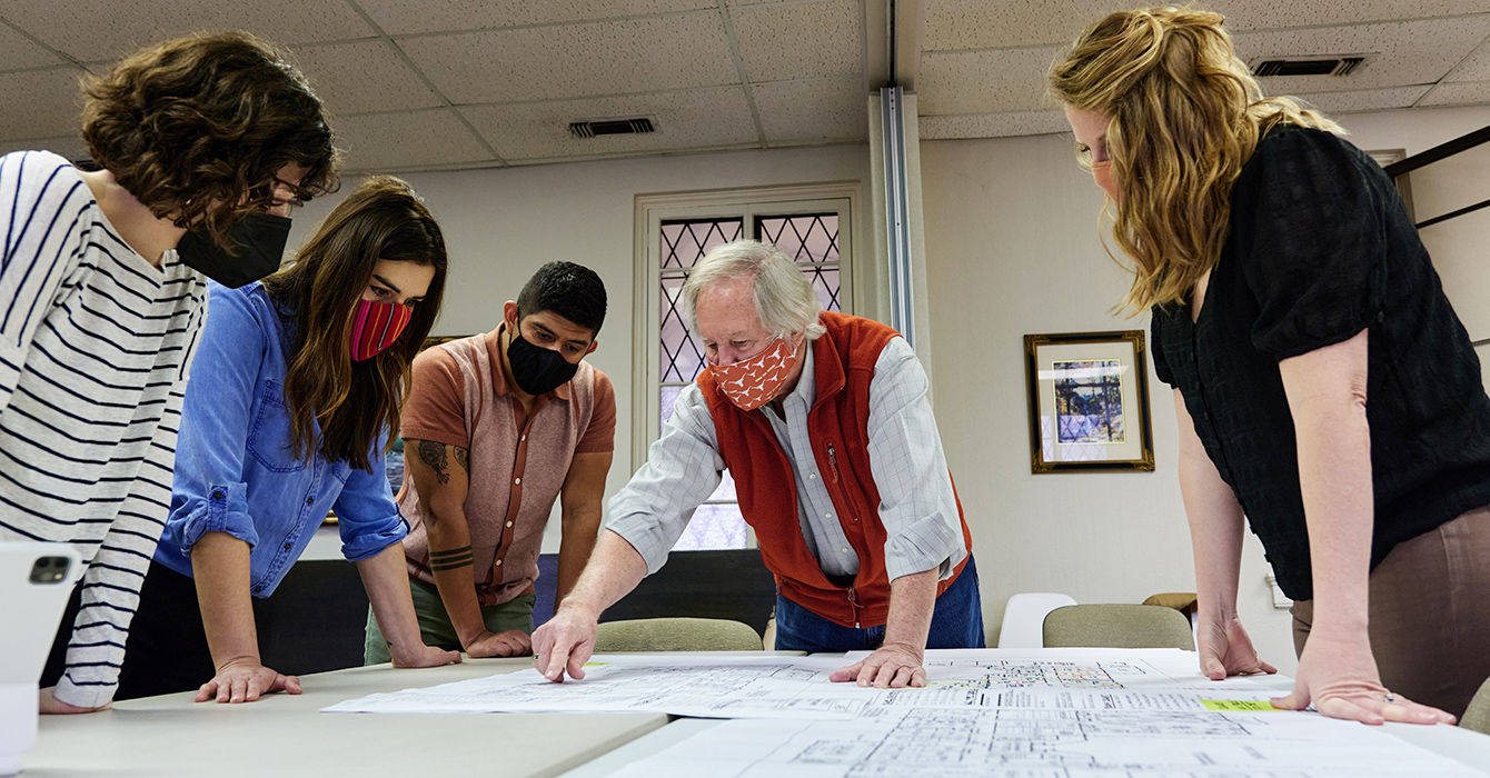 Taylor Bates, Jess Lowry, Aaron Villarreal, Howell Ridout and Sarah Woolsey talk over plans to turn a parking lot belonging to Sunset Ridge Church of Christ in San Antonio into a park.